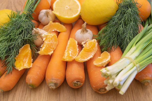 A mix of vegetables on wooden background
