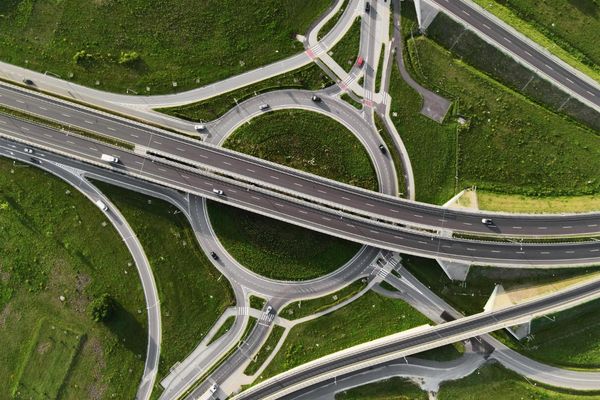 cars driving on round intersection in city