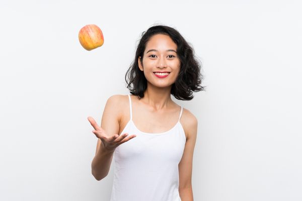 Asian young woman with an apple